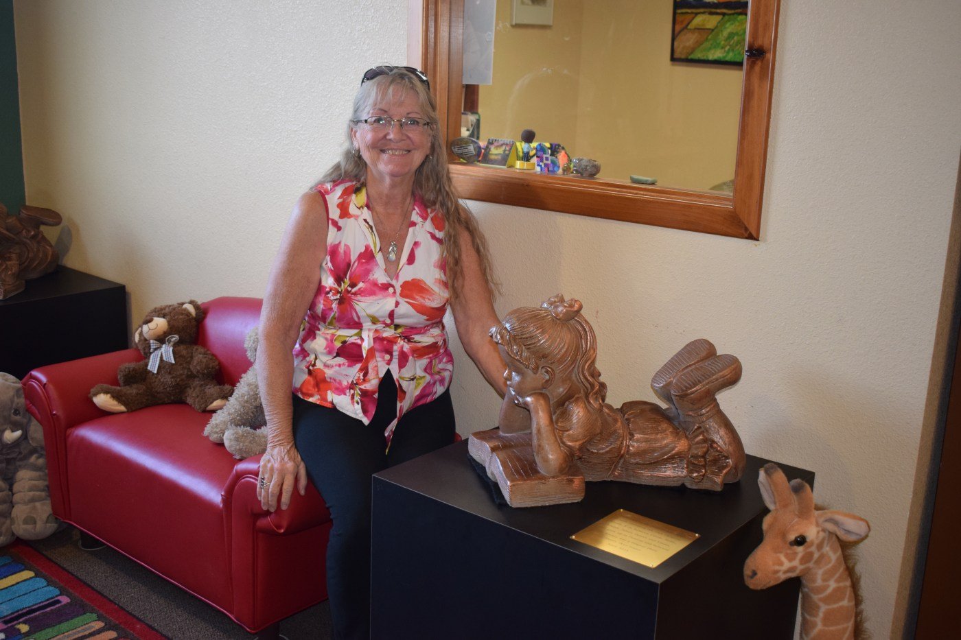 A love of reading: Sherry Skye Stuart makes nice donation to Penrose Community Library