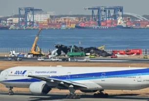 all 367 passengers 12 crew board japan airlines plane escaped down emergency slides