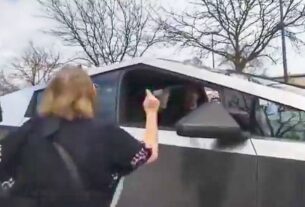 protester argues with cybertruck owner