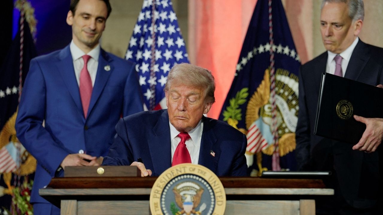 President Donald Trump signs an executive order related to artificial intelligence during the Winning the AI Race Summit in Washington D.C. U.S. July 23 2025. ReutersKent Nishimura